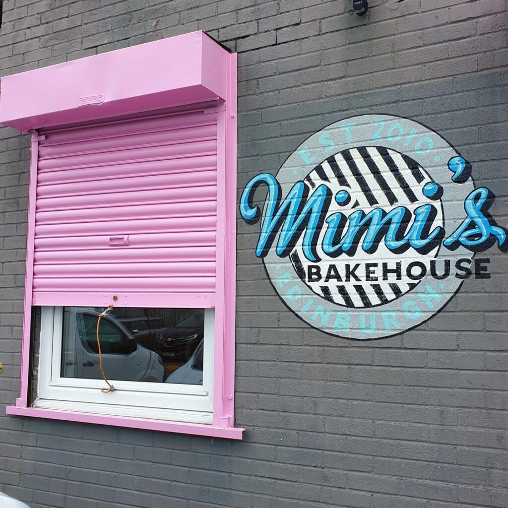 The pink bakery hatch at Mimi’s Bakehouse HQ in Granton